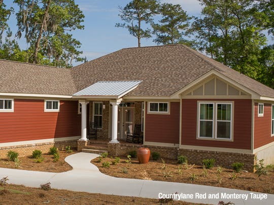 red house with beige trim