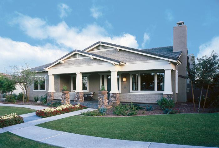 a Craftsman house with a low slung roof and fiber cement siding