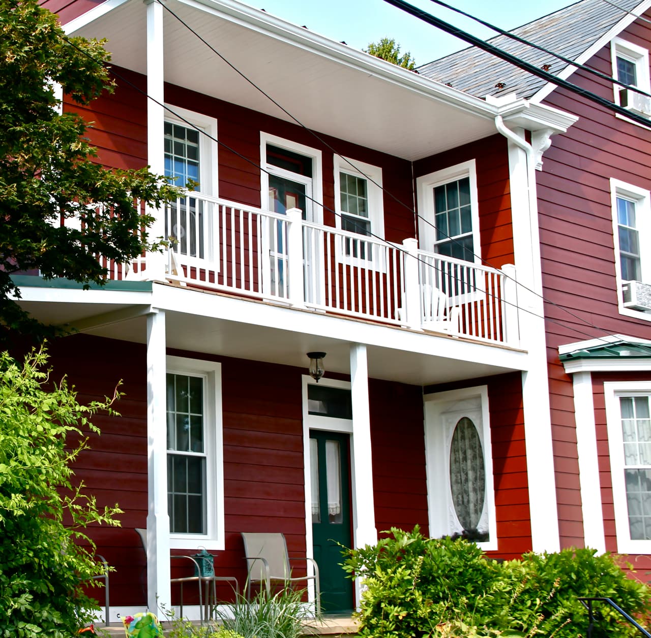 Selecting siding and trim for a whole house re-side: two story house clad in Countrylane Red Hardie Plank and Arctic White Hardie Trim Two story house clad in Countrylane Red Hardie Plank and Arctic White Hardie Trim