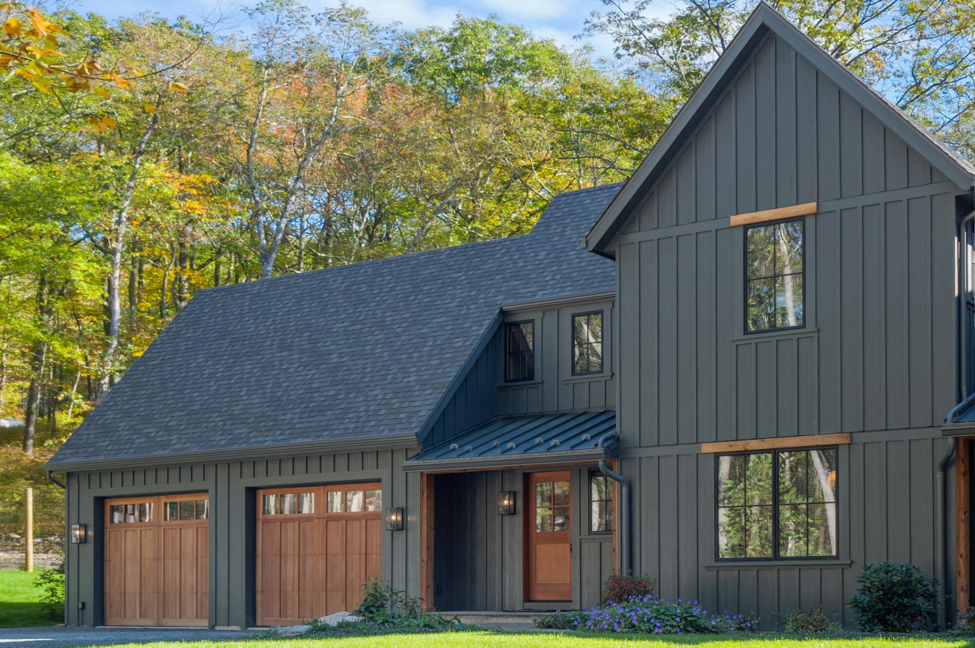 black bear house with hardie board and batten in iron gray