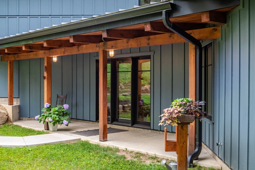 Modern house with Evening Blue Hardie board and batten siding Modern house with Evening Blue Hardie board and batten siding