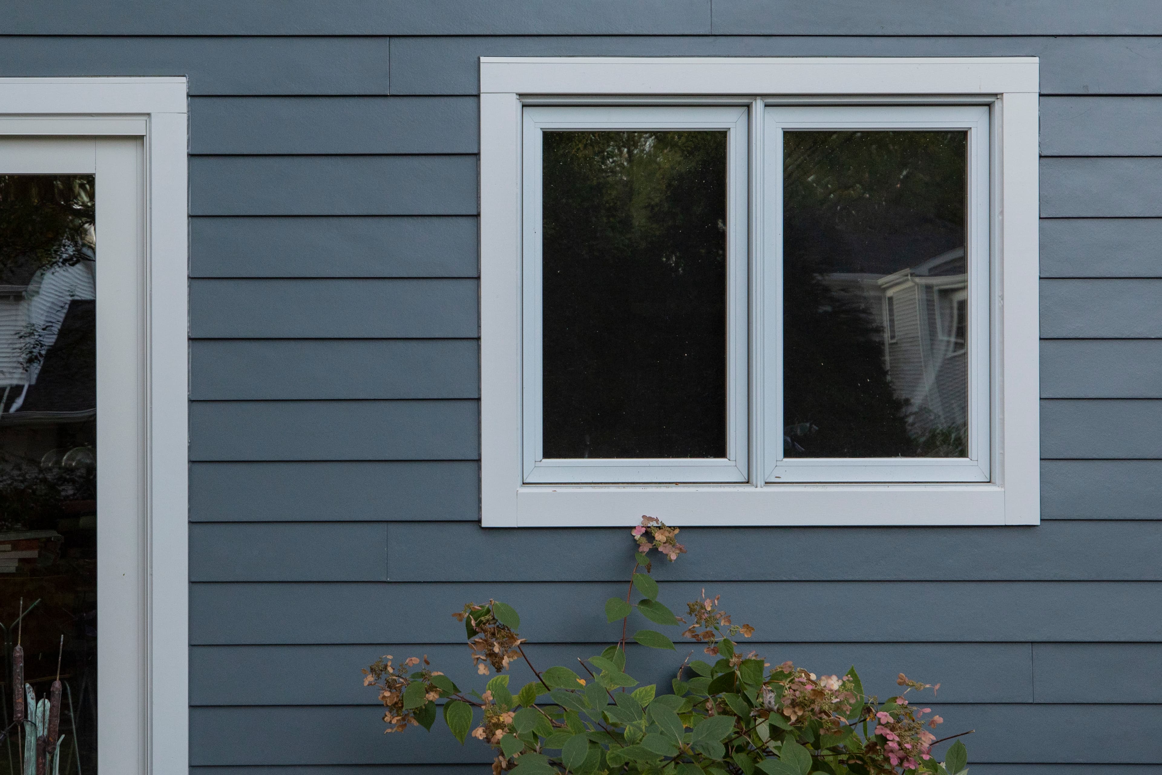 Prepare Your Home for Winter: INSTALL STORM WINDOWS Evening Blue Lap siding with storm windows