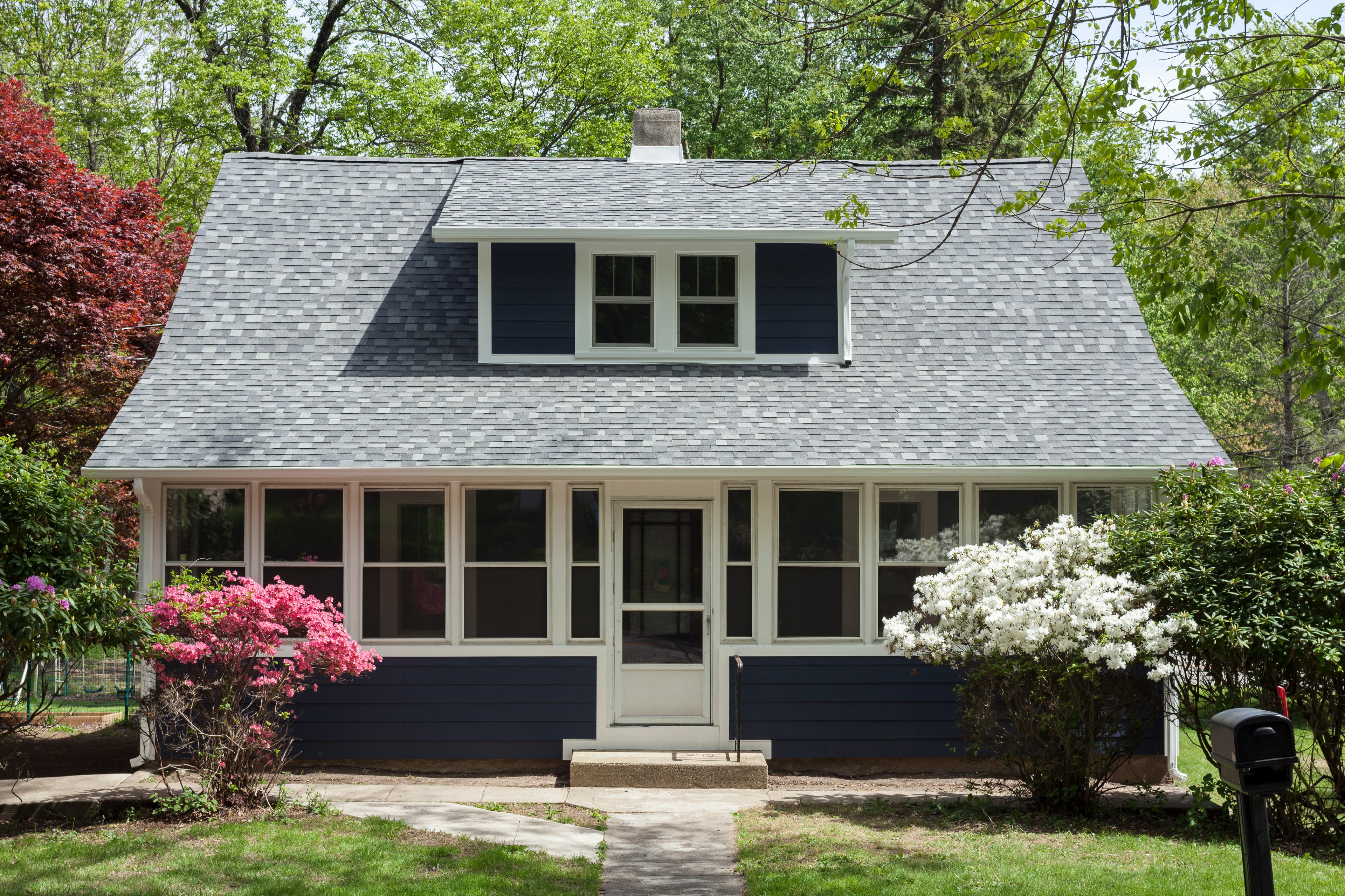 Curb Appeal 101: House clad with Hardie® Plank in Deep Ocean and Hardie® Soffit in Arctic White House clad with Hardie® Plank in Deep Ocean and Hardie® Soffit in Arctic White