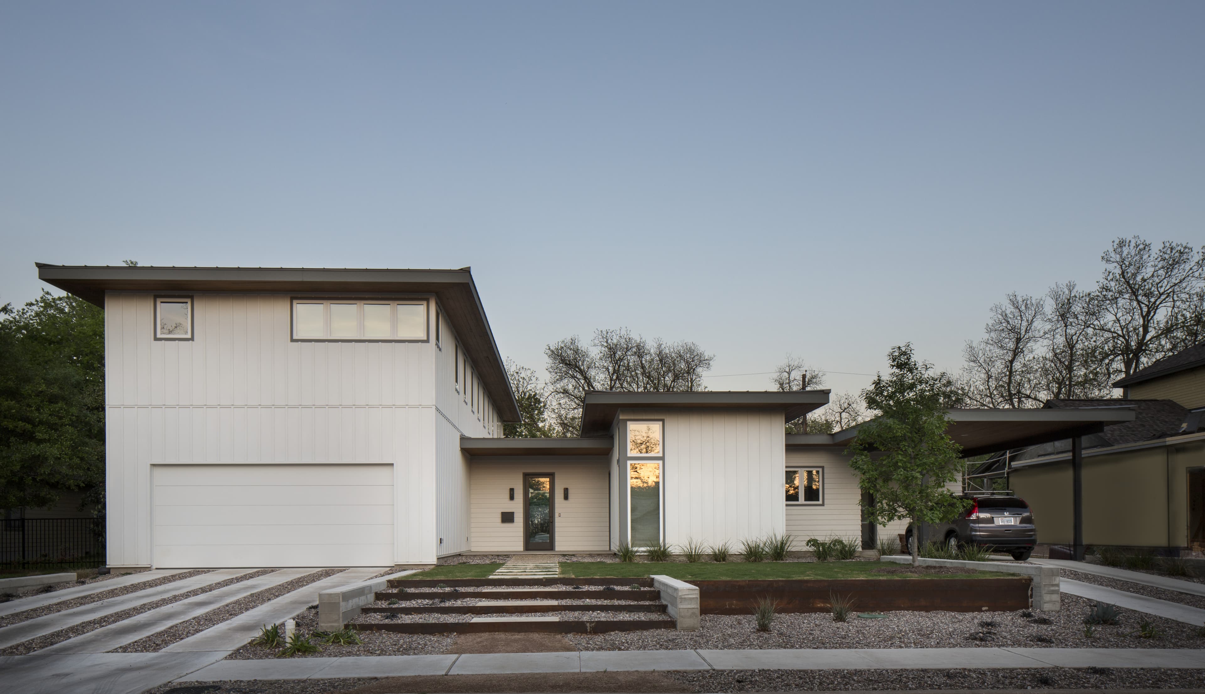 Contemporary - Simple modern home in Arctic White Hardie panel and board and batten siding Simple modern home in Arctic White Hardie panel and board and batten siding