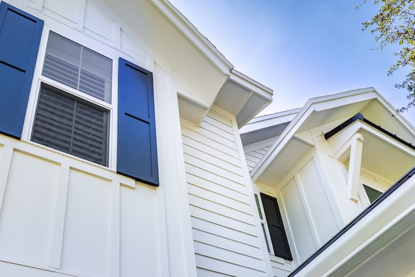 Mixing Siding Styles: Home clad in Hardie Panel, Hardie Batten trim, and Hardie plank Mixing Siding Styles: Home clad in Hardie Panel, Hardie Batten trim, and Hardie plank