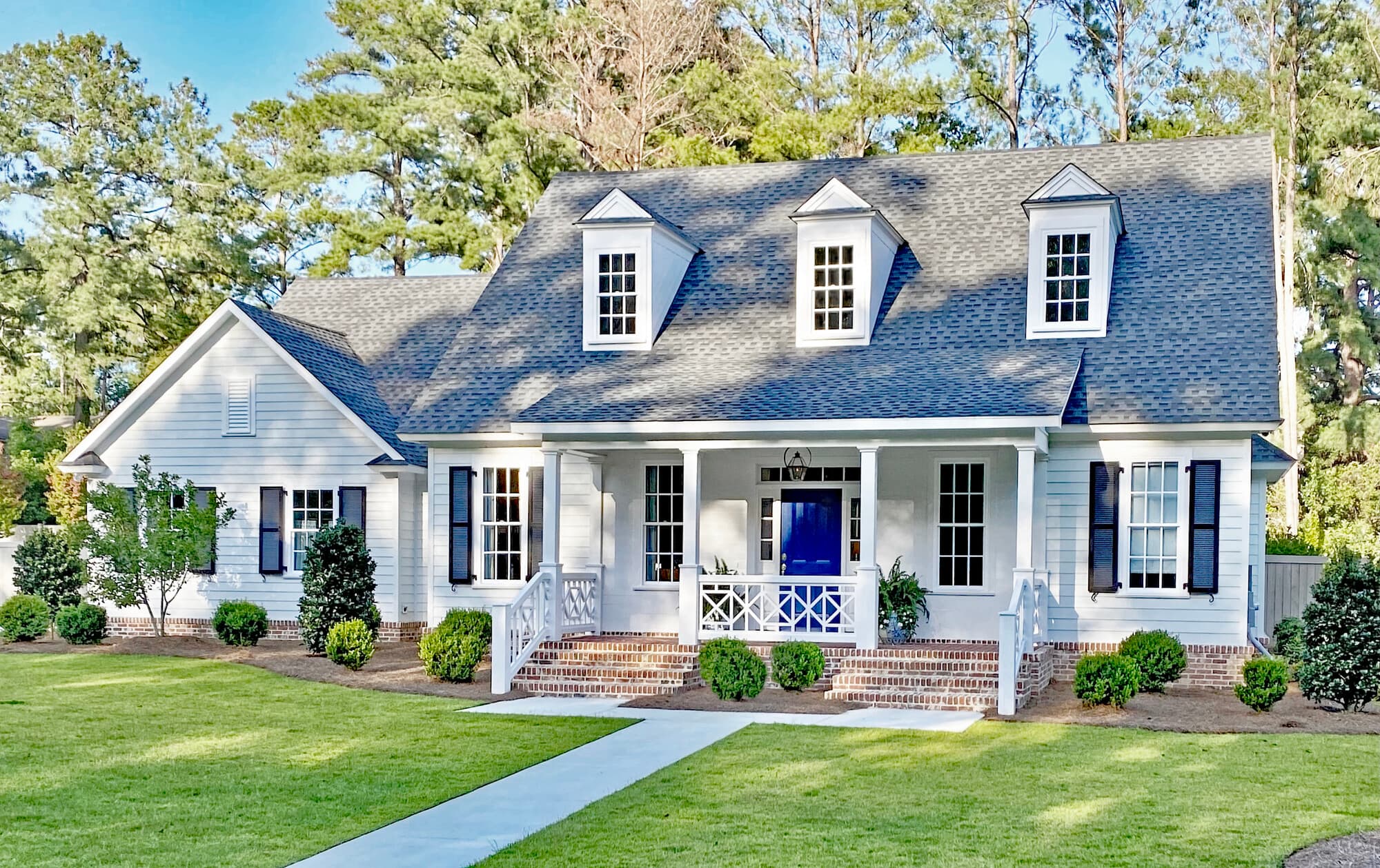 Cape Cod home clad in Arctic White Hardie Plank lap Cape Cod home clad in Arctic White Hardie Plank lap