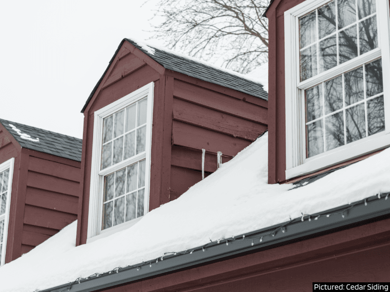 Prepare Your Home for Winter: INSPECT THE ROOF Snow covered roof and red cedar siding