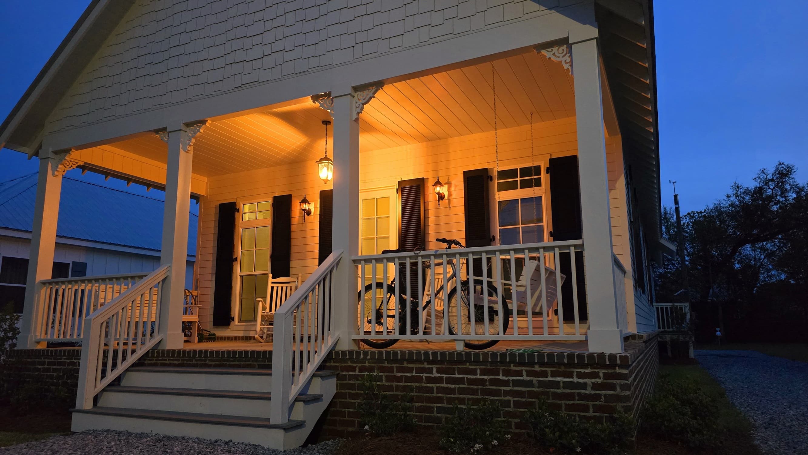 Using the new to save the old: front of house in evening Using the new to save the old: front of house in evening