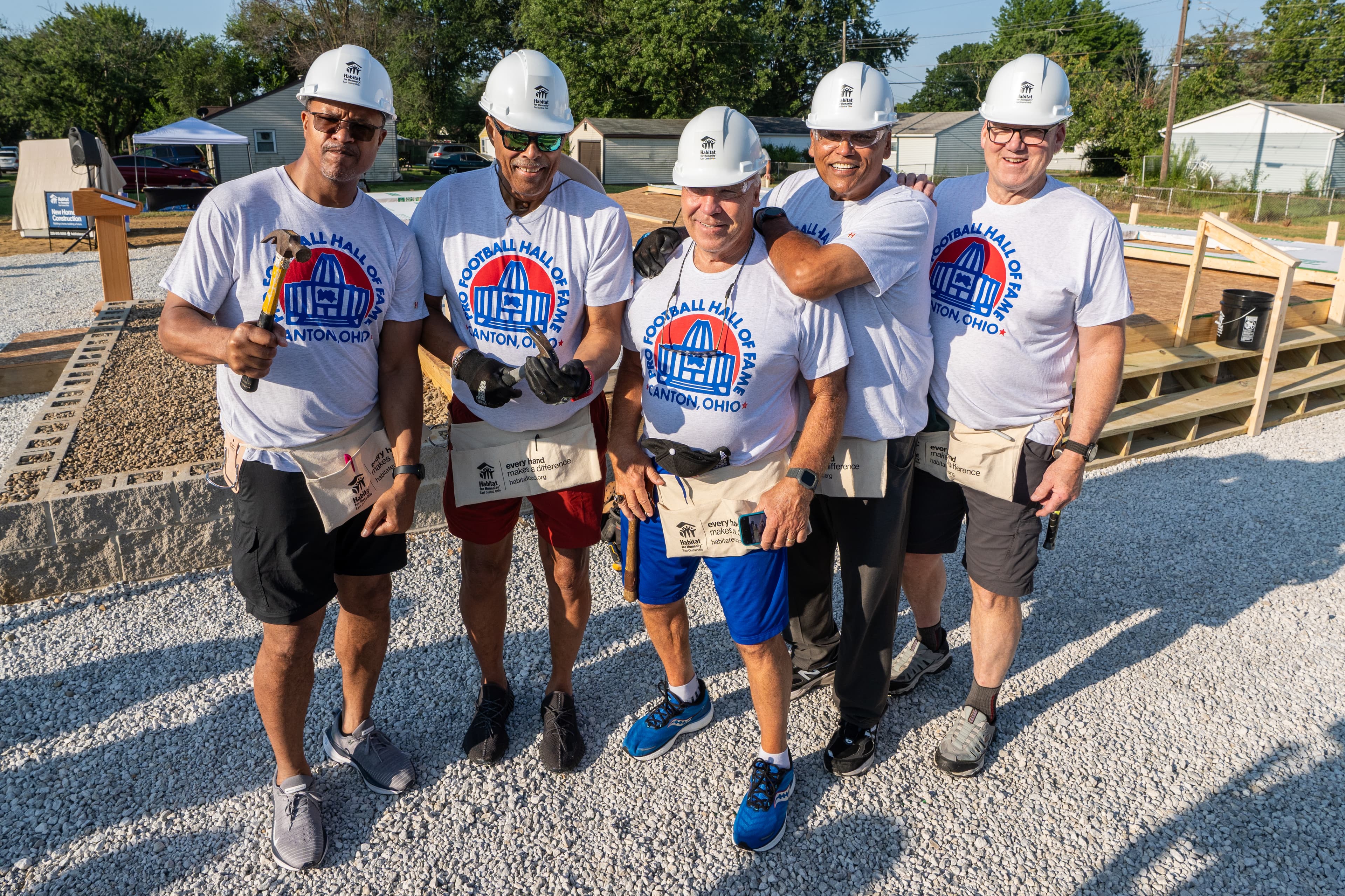 Pro Football Hall of Fame members volunteer to help raise the walls of a new Habitat for Humanity home being built for afamily in Canton, OH.   Pro Football Hall of Fame members volunteer to help raise the walls of a new Habitat for Humanity home being built for a family in Canton, OH.